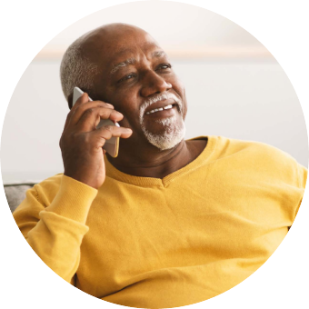 Man in yellow shirt talking on the phone