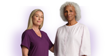 Nurse with burgundy scrubs and woman in white t-shirt smiling with purple background